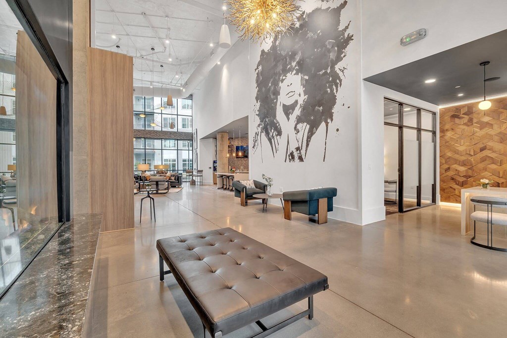 a lobby with a bench and a table