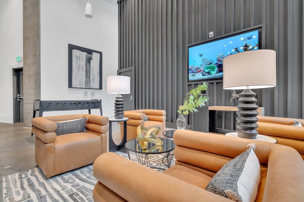 a living room with couches and a tv