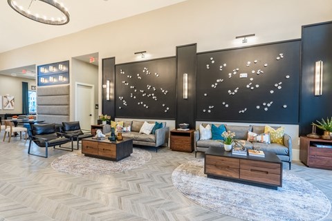 a lobby with couches and a table