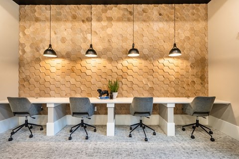 a large office space with a desk and chairs