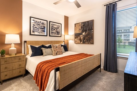 a bedroom with a bed and a window