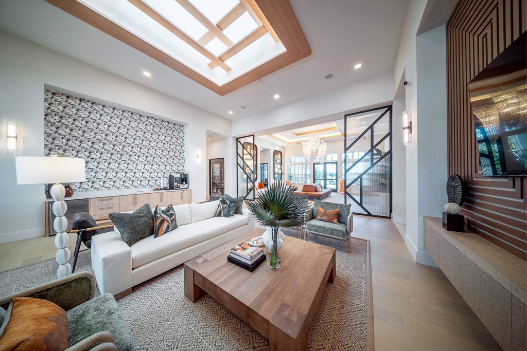 a living room with a white couch and a coffee table