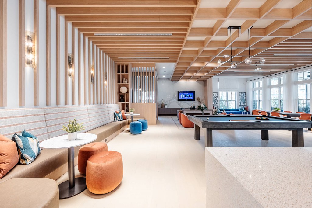 the lobby of a hotel with a pool table