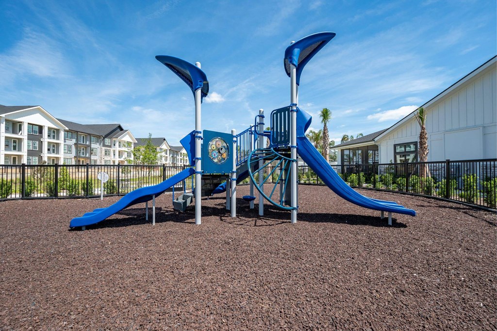 our playground is equipped with a swing set and slides