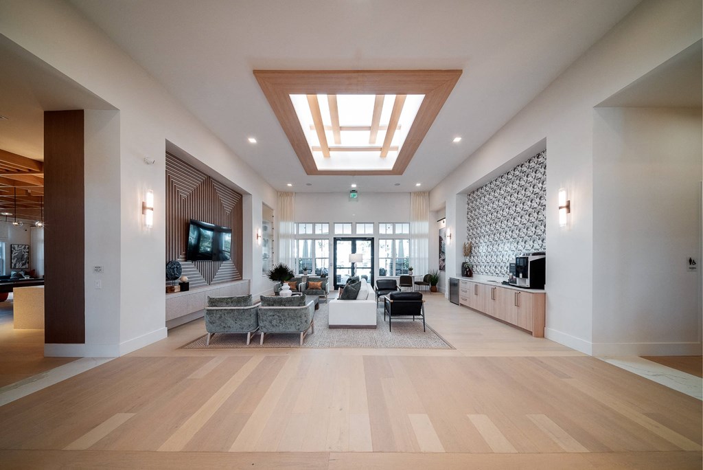 a large living room with furniture and a ceiling light