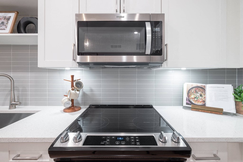 a kitchen with a stove and a microwave