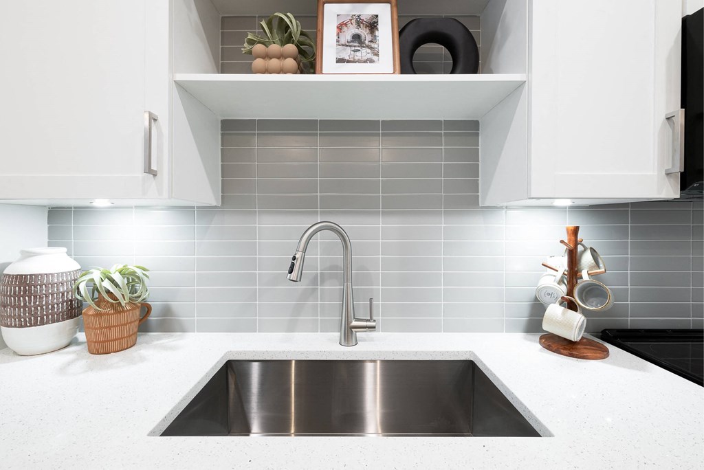 a kitchen with a sink and a faucet