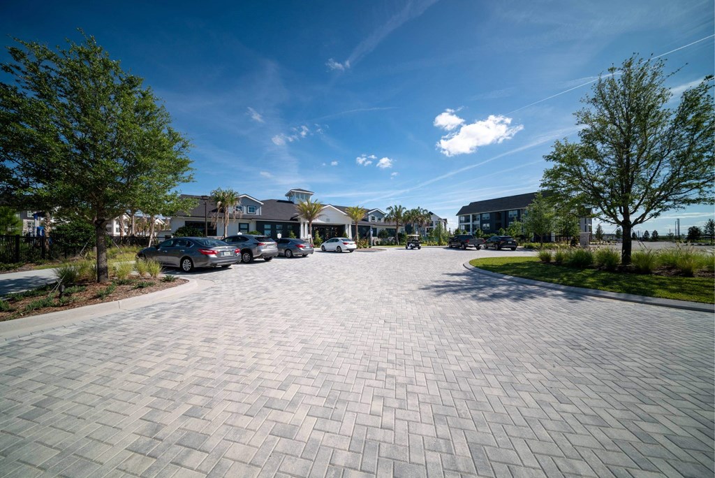 a parking lot with cars parked on the side of a street