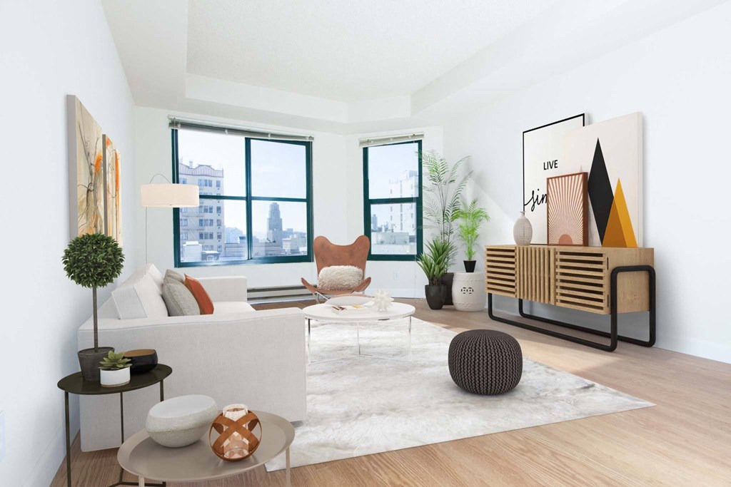 a living room with a white couch and a large window
