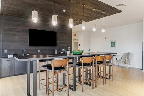 a large kitchen with a large island with chairs