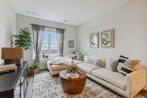 a living room with a couch and a table