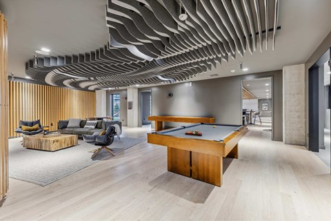 a pool table in the lobby of a office building