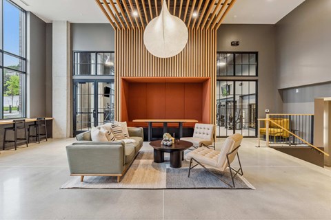 a living room with couches and chairs and a fireplace