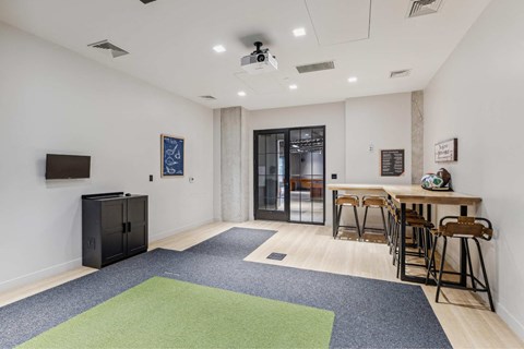a living room with a bar and a glass door