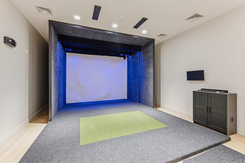 a large room with a screen and a projector