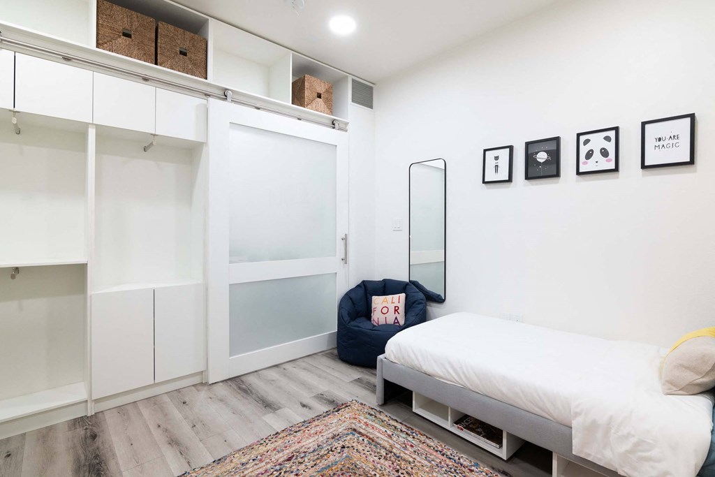 a bedroom with a bed and a closet