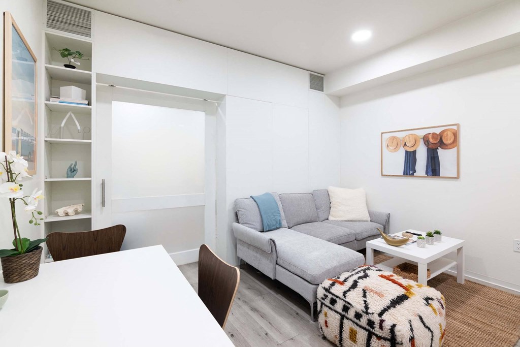 a living room with a couch and a table