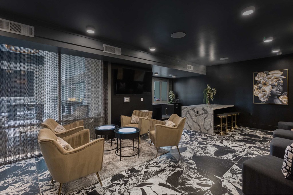 a living room with couches and chairs and a tv