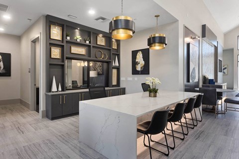 a dining room with a marble table and chairs