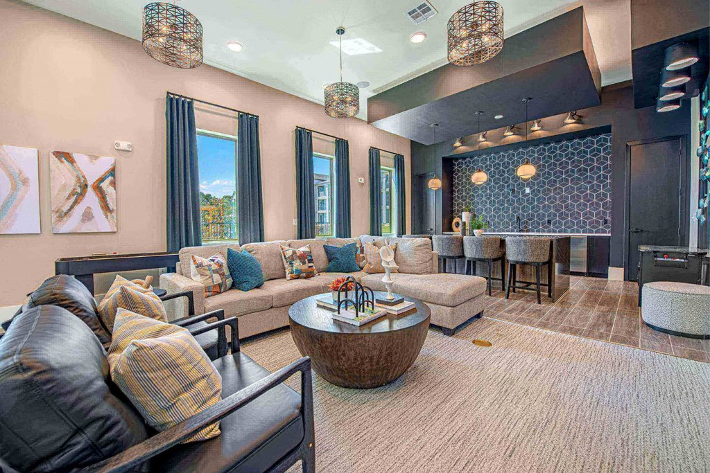 a large living room with couches and a table