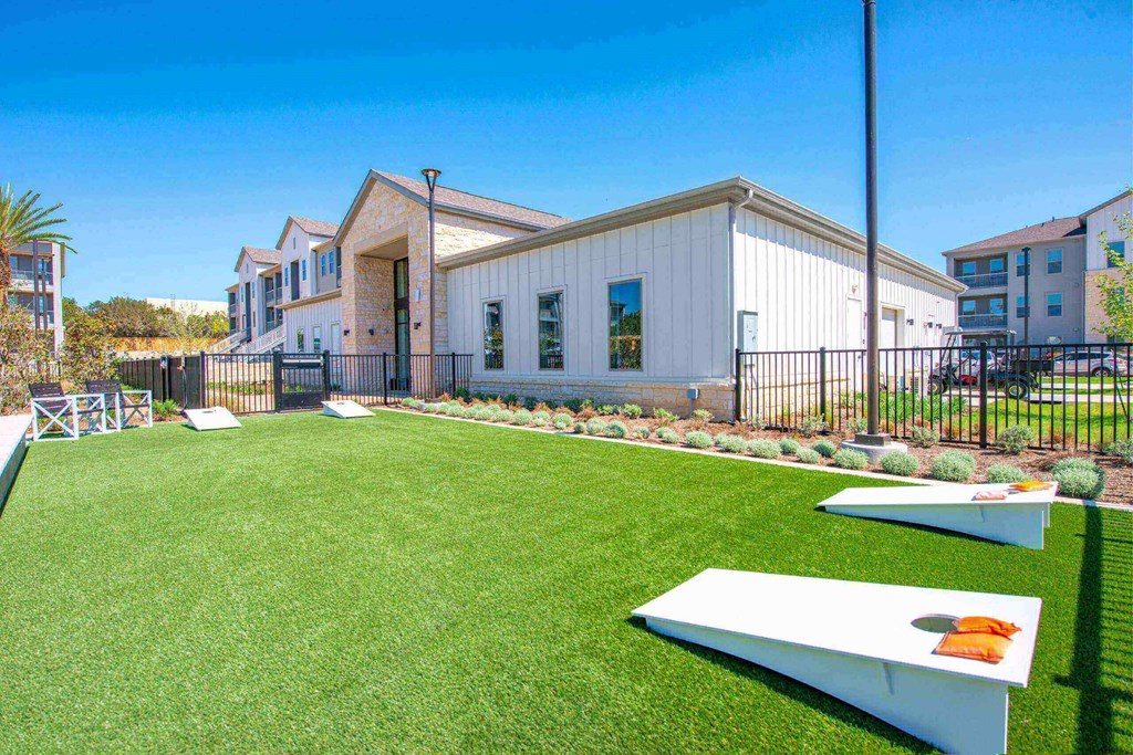 a backyard with a pool and a house