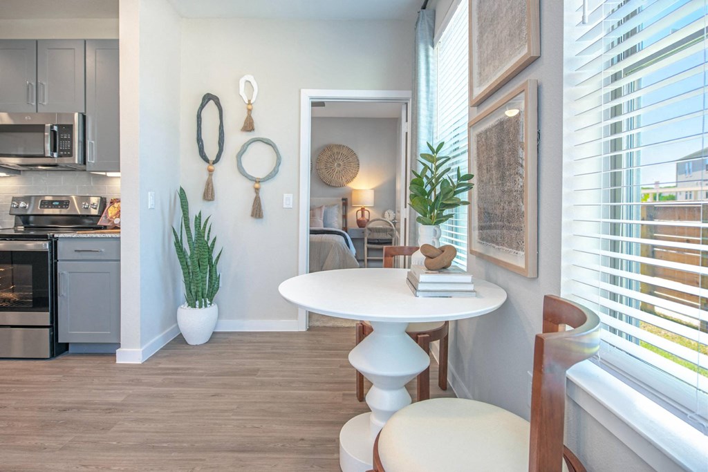 a dining room with a table and a window