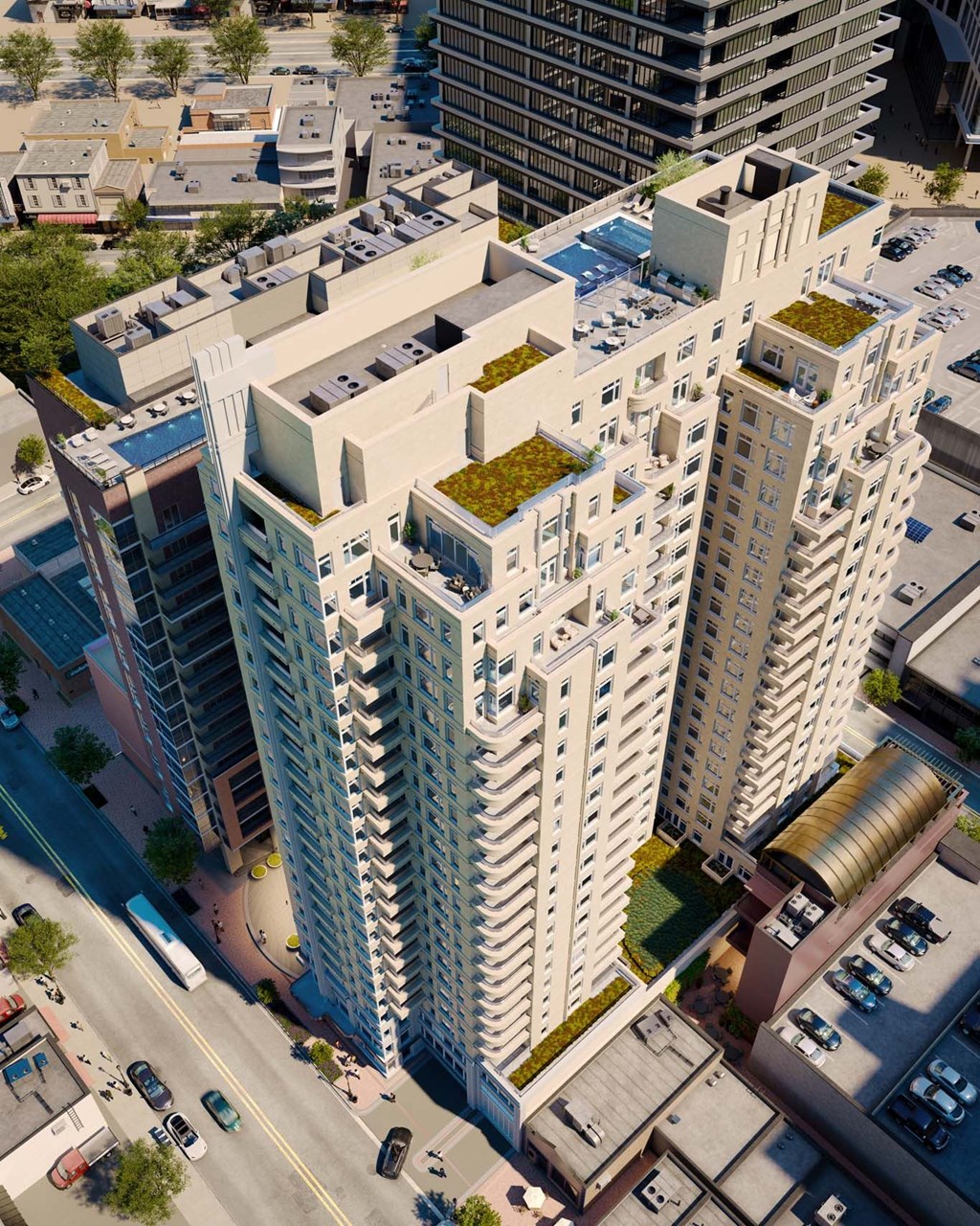 an aerial view of an apartment building with green plants on the rooftops