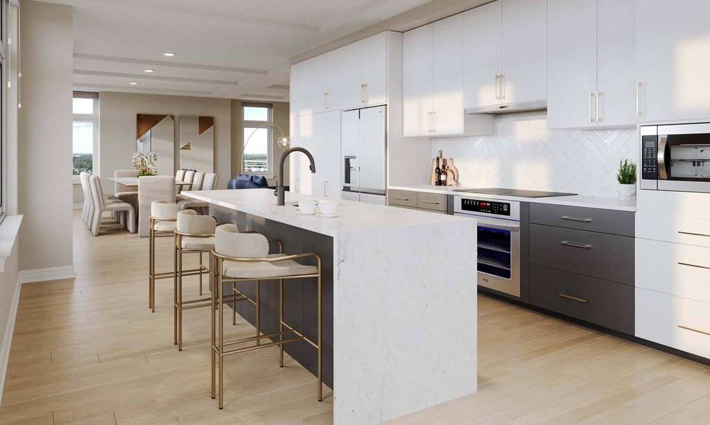 a large kitchen with white cabinets