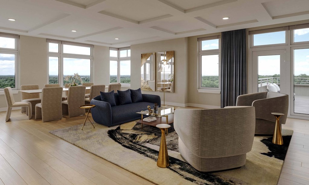 a living room with Expansive windows, spacious balconies, patios, and terraces*