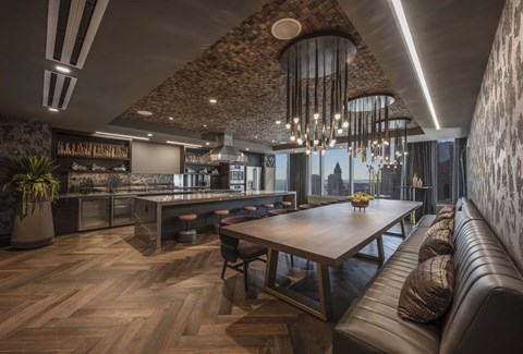 a dining room with a table and chairs and a kitchen