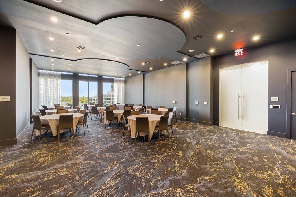 a large conference room with tables and chairs
