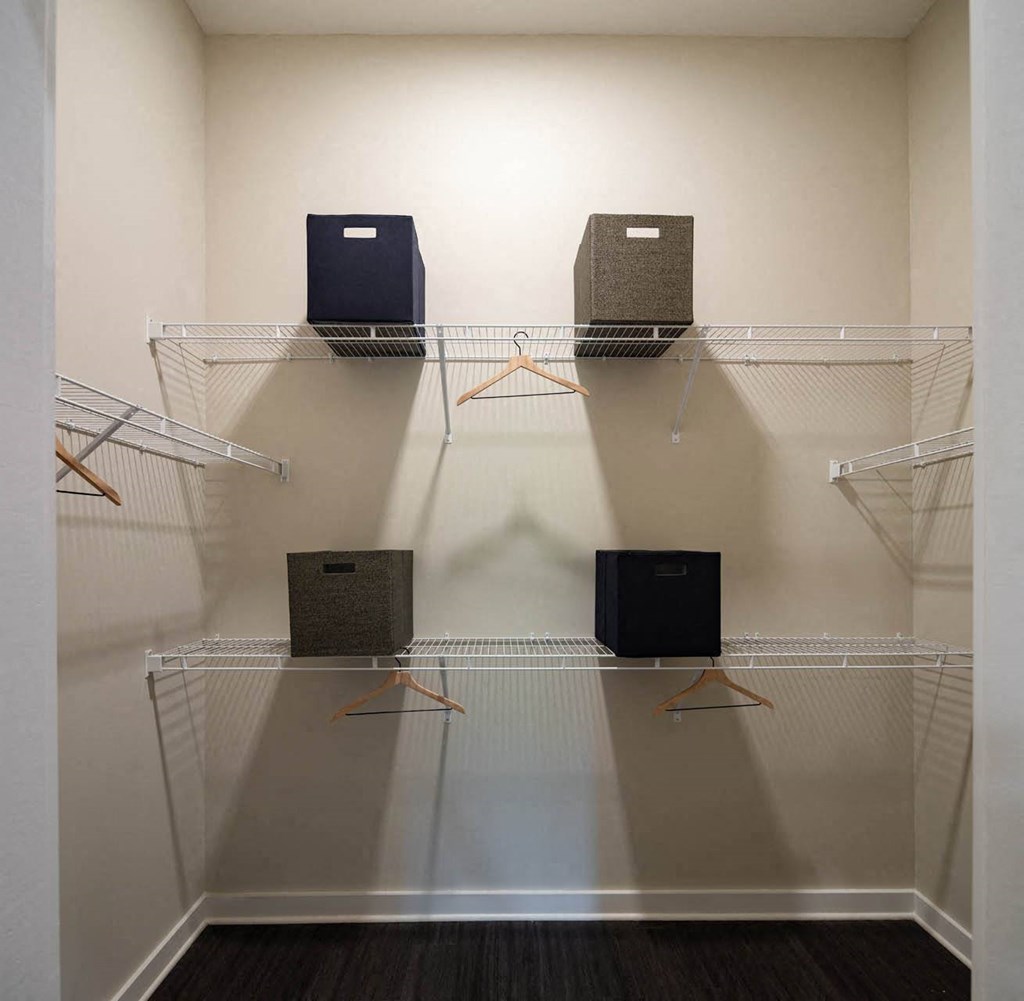 a group of speakers on a rack in a room
