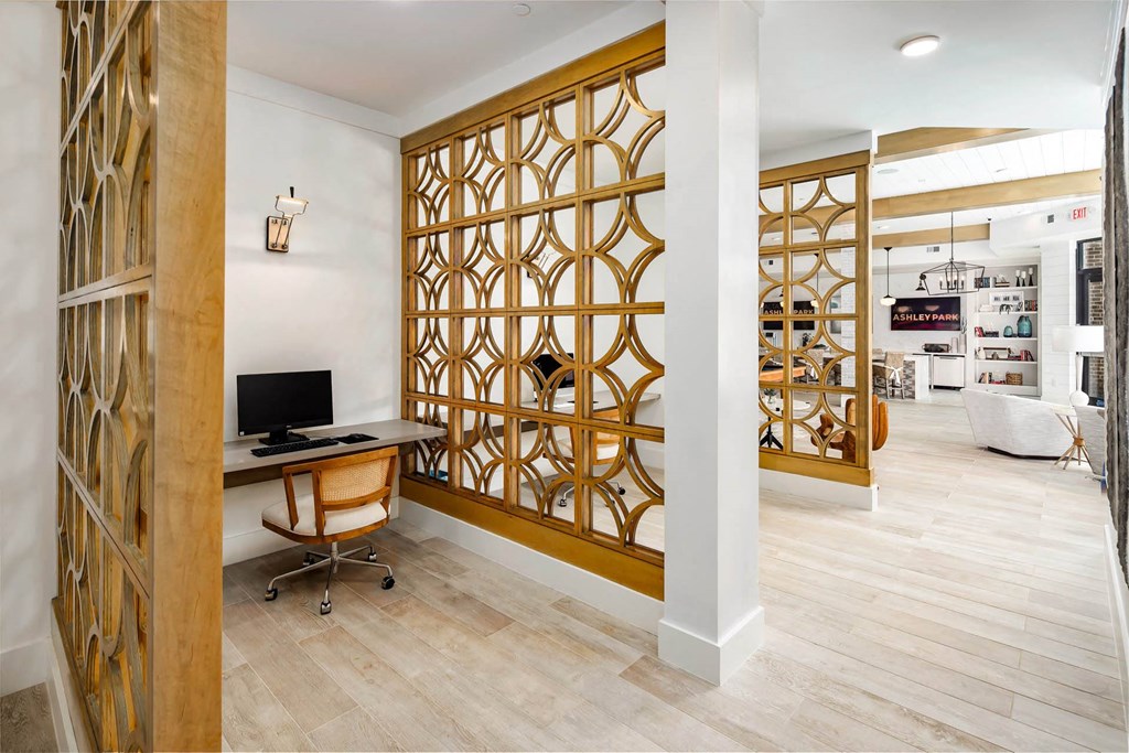 a home office with a desk and a computer in a room