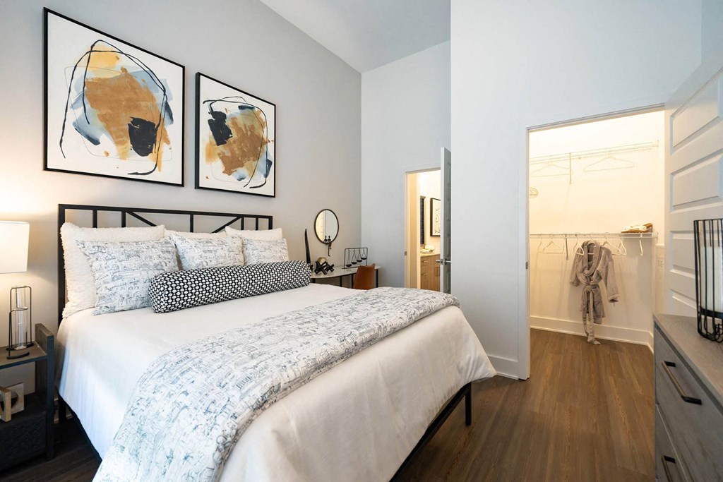 a bedroom with a bed and a closet