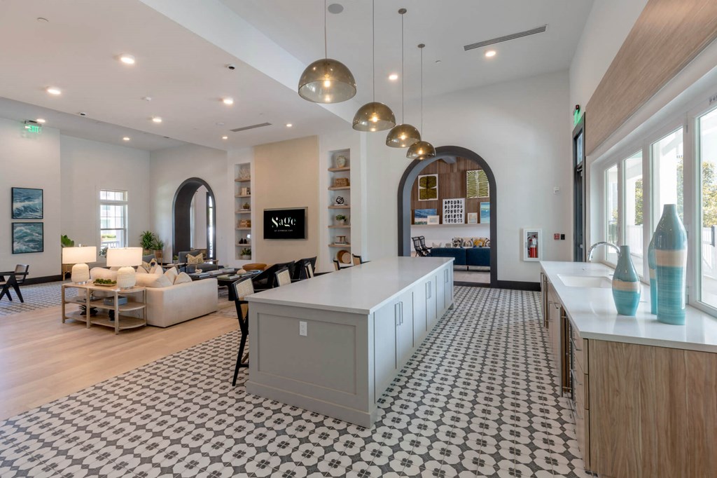 a large room with a kitchen and a living room