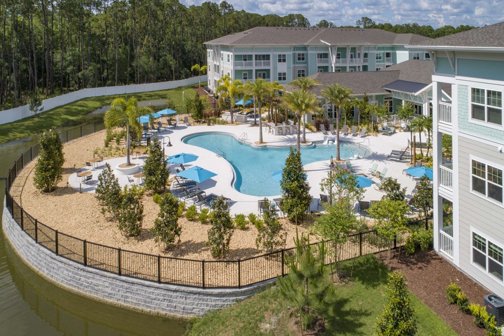 an aerial view of the pool at the resort at longboat key club