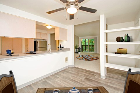 a kitchen and living room with a ceiling fan at Vista Ridge, Issaquah, WA