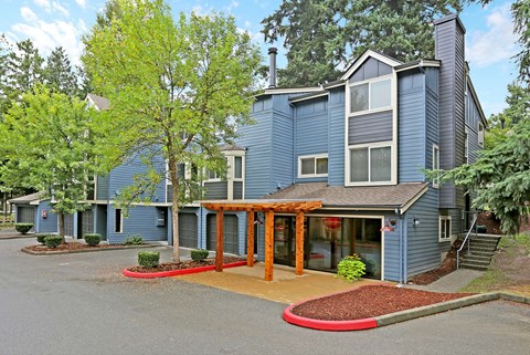Two story building exterior with pergola entrance at Hubbard's Crossing Apartments, Kirkland, WA