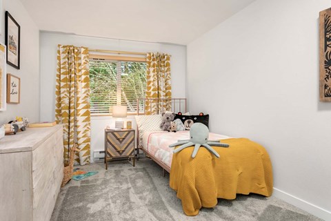 a bedroom with a bed and a window with a yellow curtain at Scout, Washington, 98034
