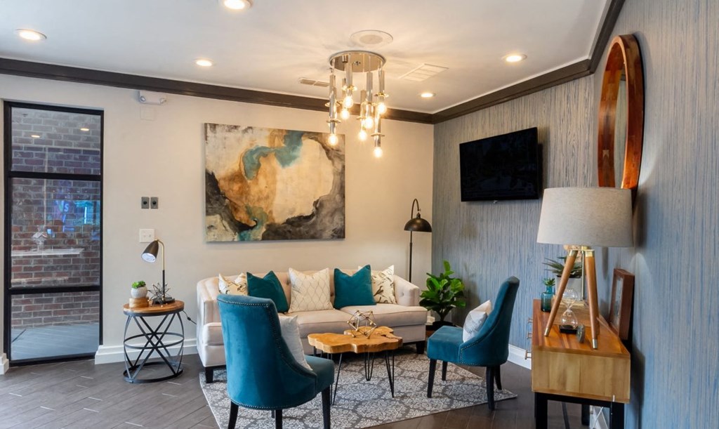 a living room with a couch and a chandelier
