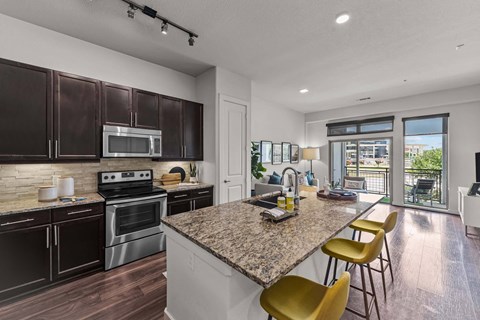 a kitchen with a granite counter top and a sink