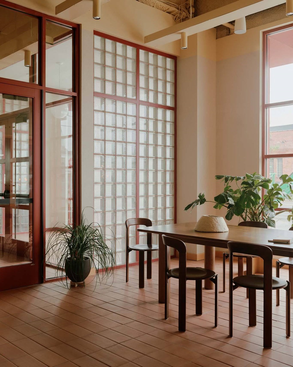 a dining room with a table and chairs