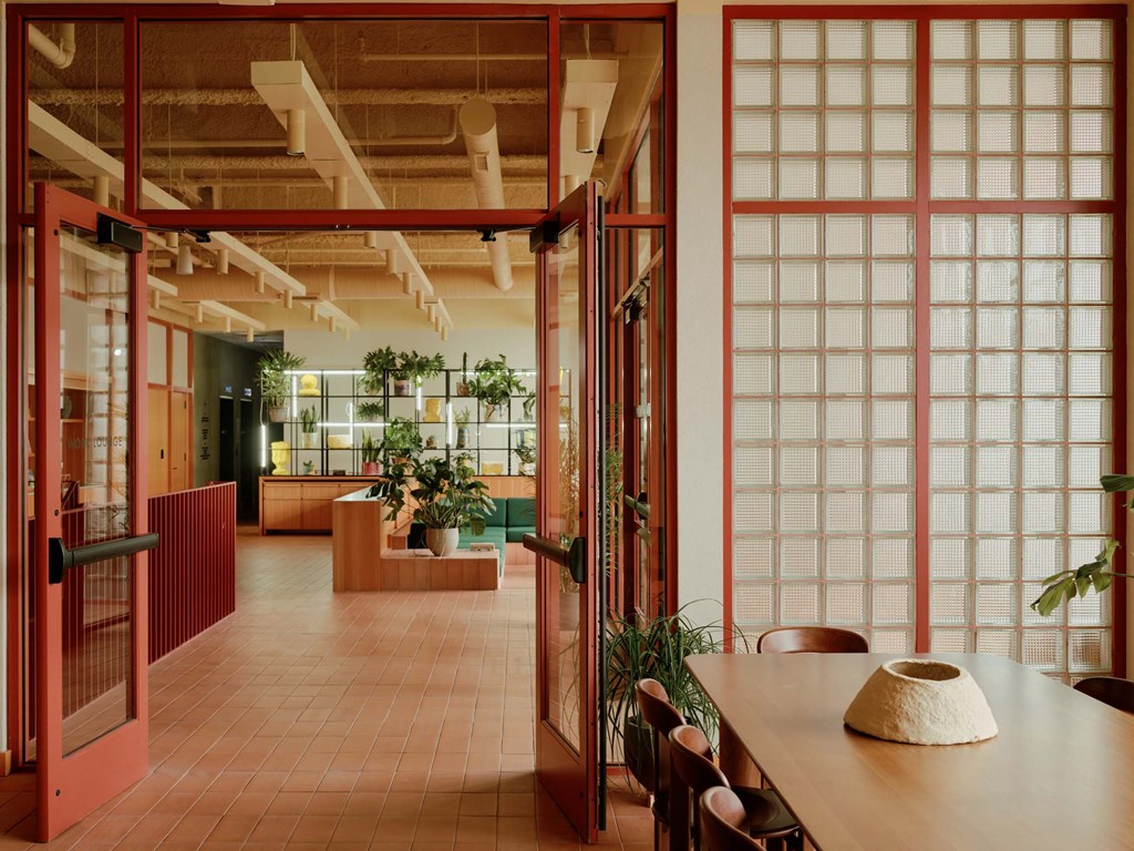 a large room with glass doors and a table and chairs