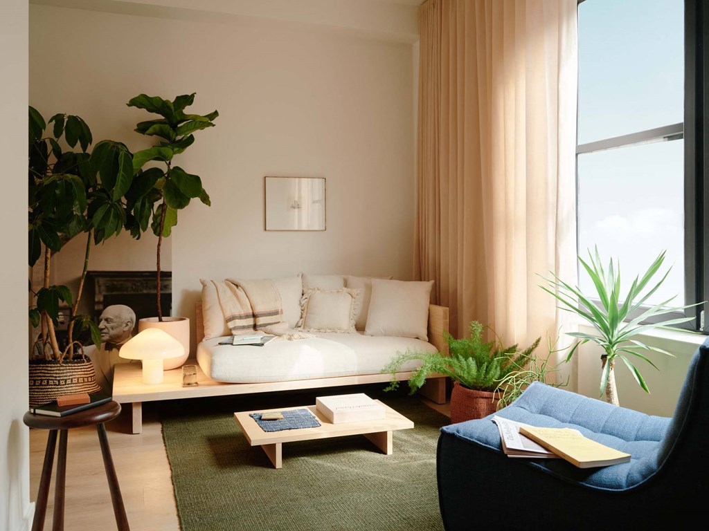 a living room with a couch and a large window