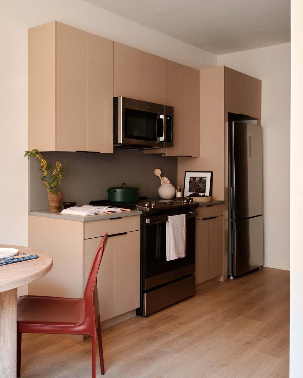 a small kitchen with a stove and a refrigerator