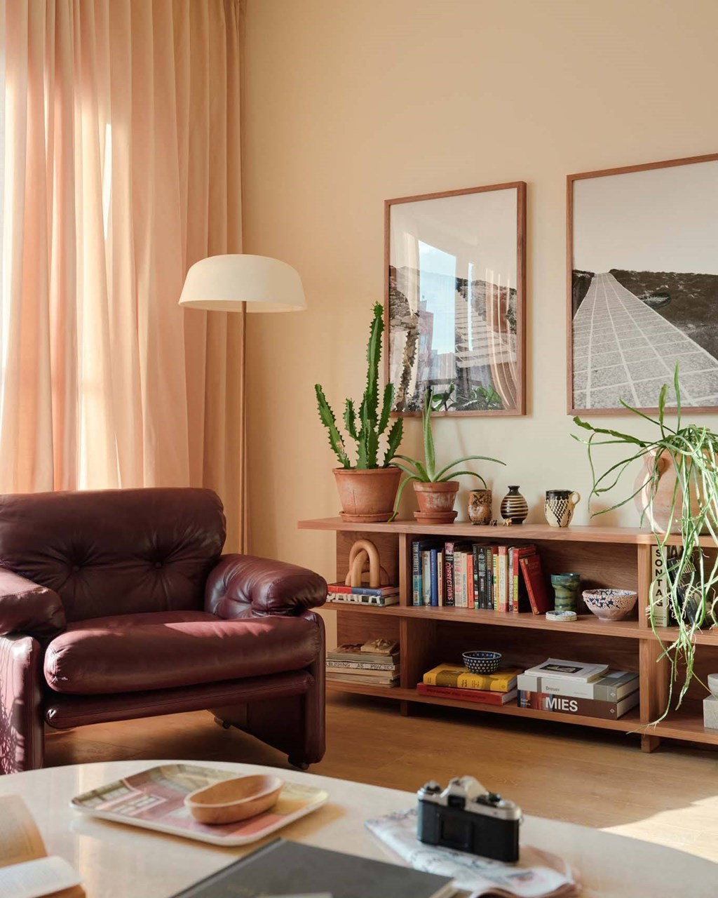 a living room with a leather couch and a table