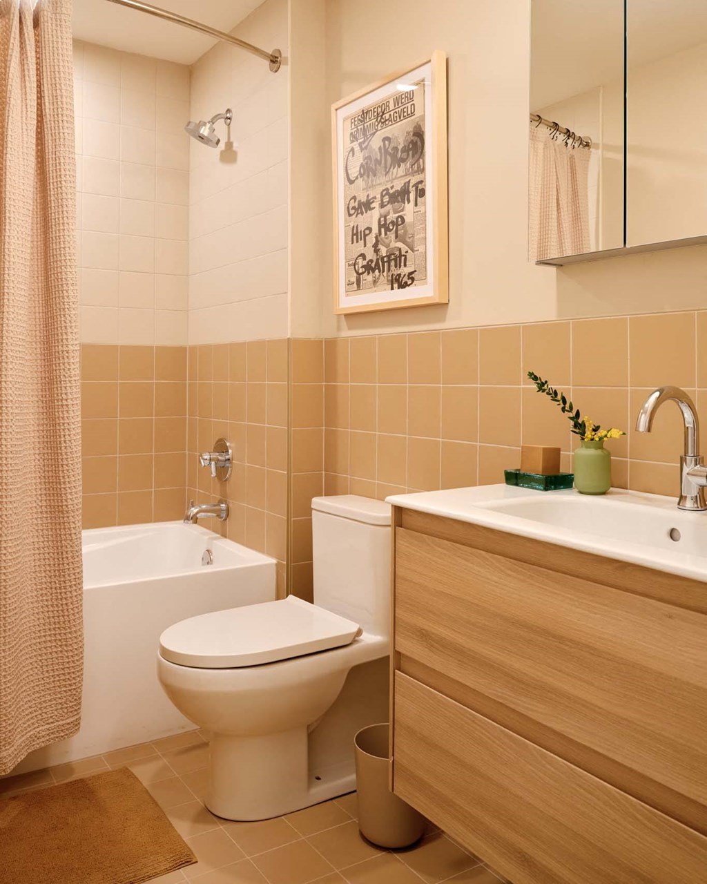 a bathroom with a toilet and a sink and a bath tub