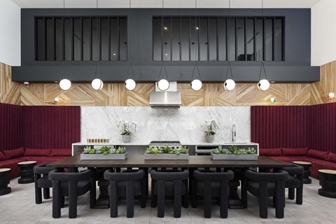 a large kitchen with a long table and chairs