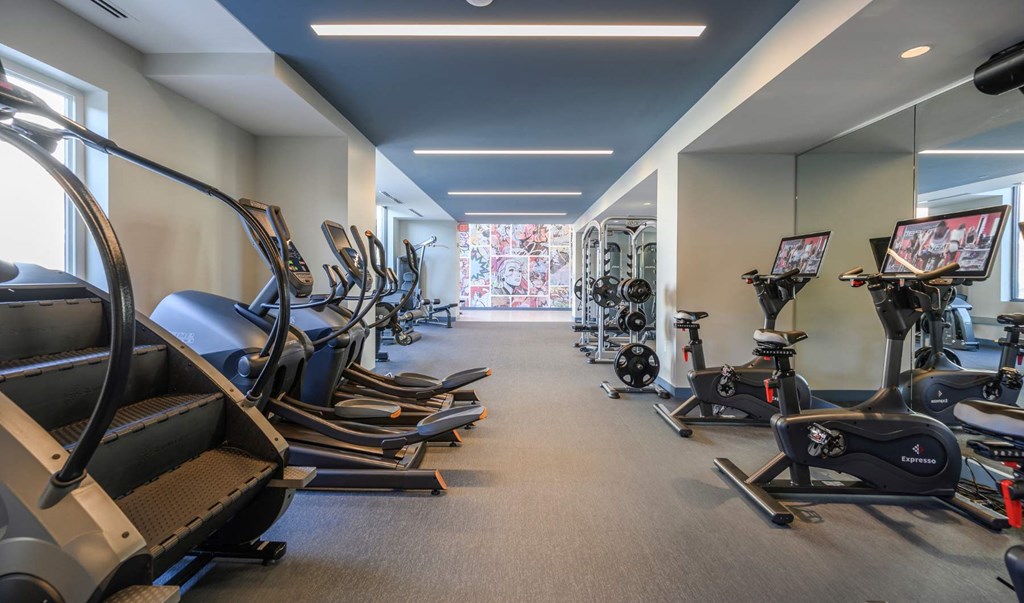 a gym with cardio equipment and exercise machines