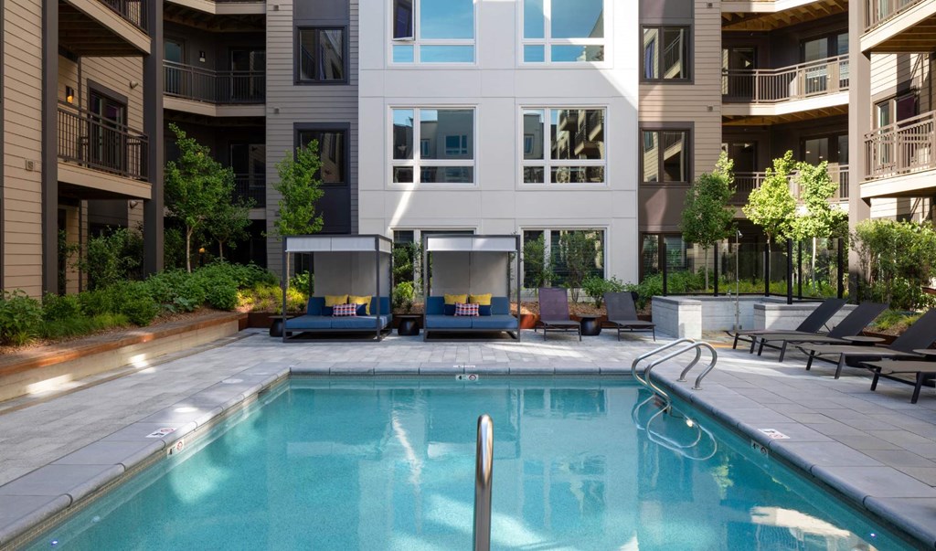 a swimming pool in front of a building